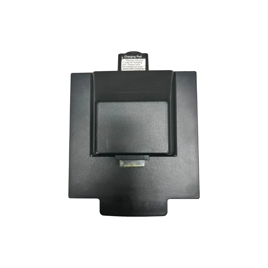 A close-up of a black charging port for the Journey So Lite Scooter Parts & Accessories shows its rectangular design with a central flap. Labeled Charging Port, it sits against a plain white background, highlighting its compact, airline-friendly design with lithium battery efficiency.